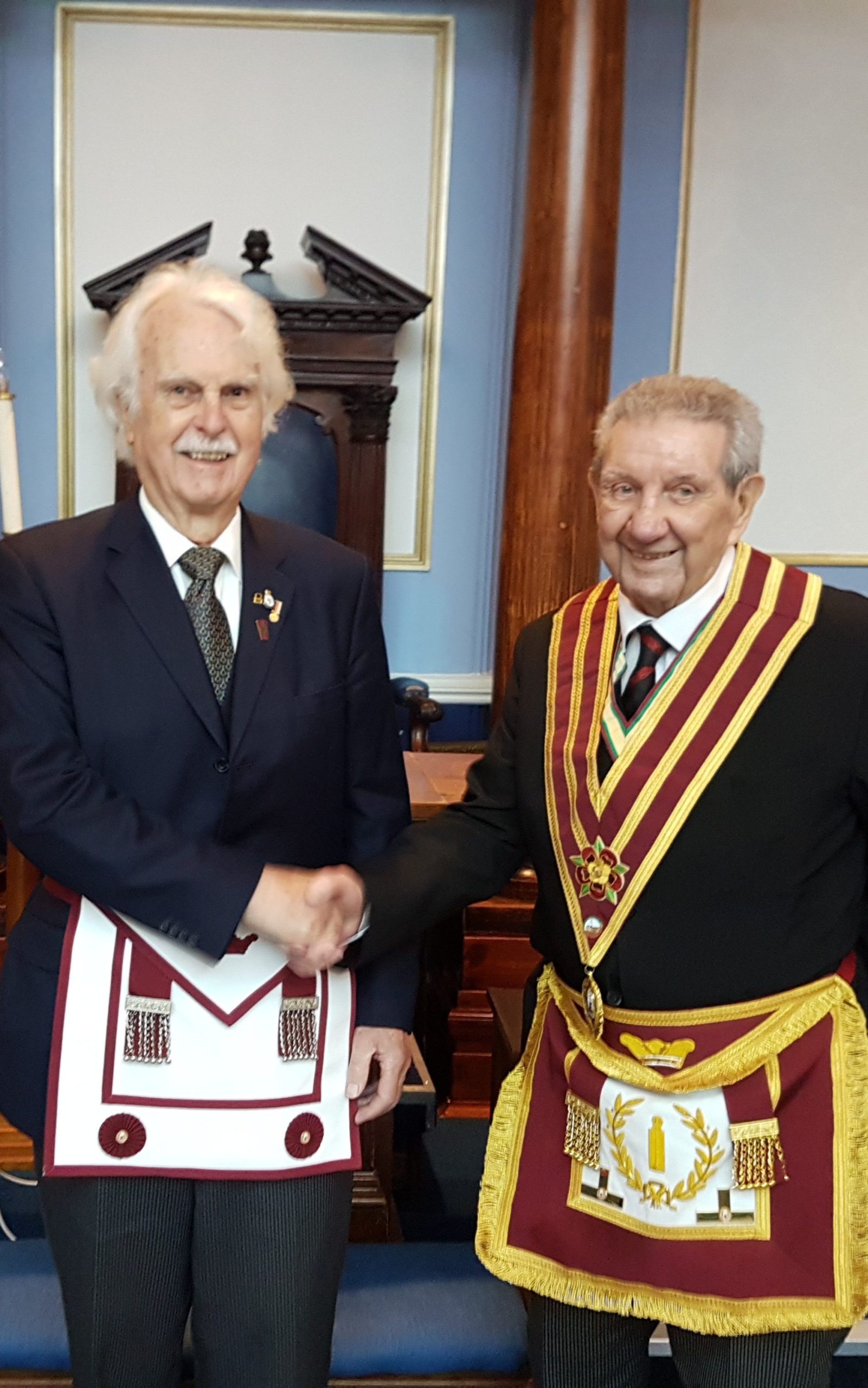 R W Bro Mervyn Western welcomes Bro Ernest Niel into the Order